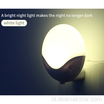 Lampu malam LED plug-in dengan kontrol cahaya